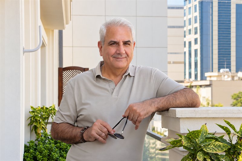 Hamid Motahari standing on a terrace
